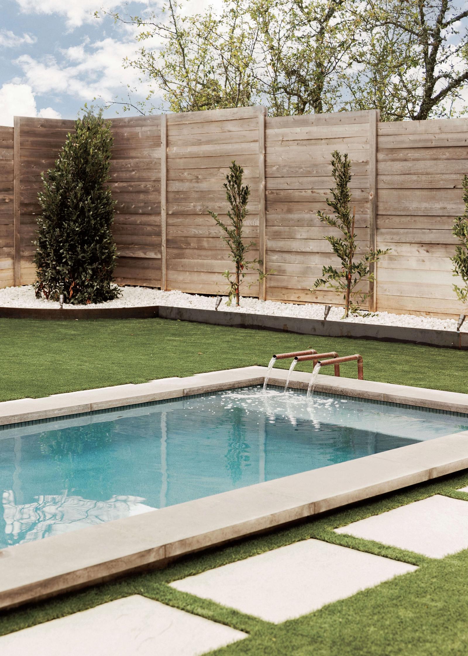 Golden Hour Pools Mini in Dallas, featuring mini pool with fountain and lawn and gunite plaster finish