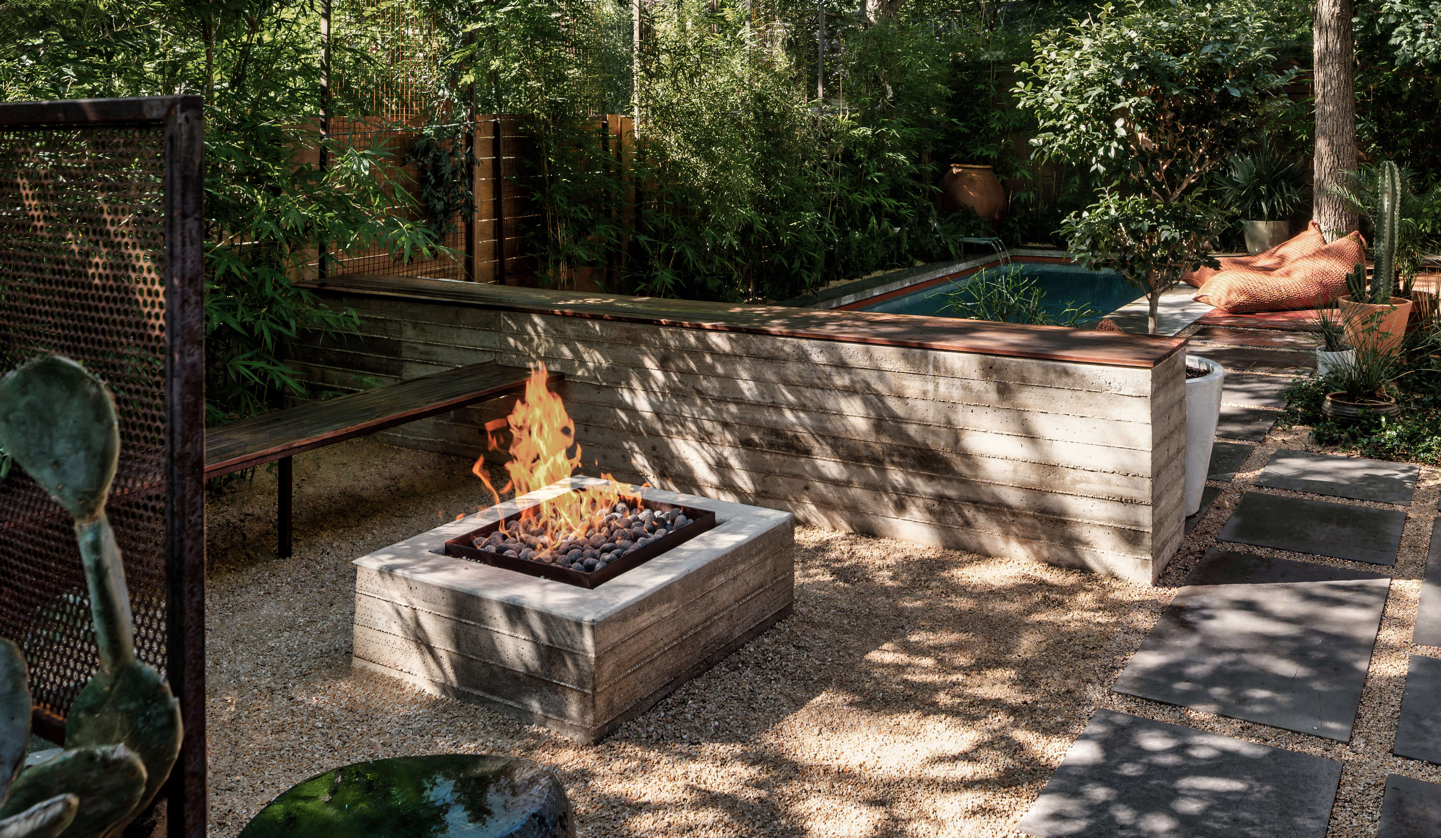 Golden Hour Pools Classic in Austin, featuring outdoor fire pit and Classic gunite pool with wood retaining wall in Zilker
