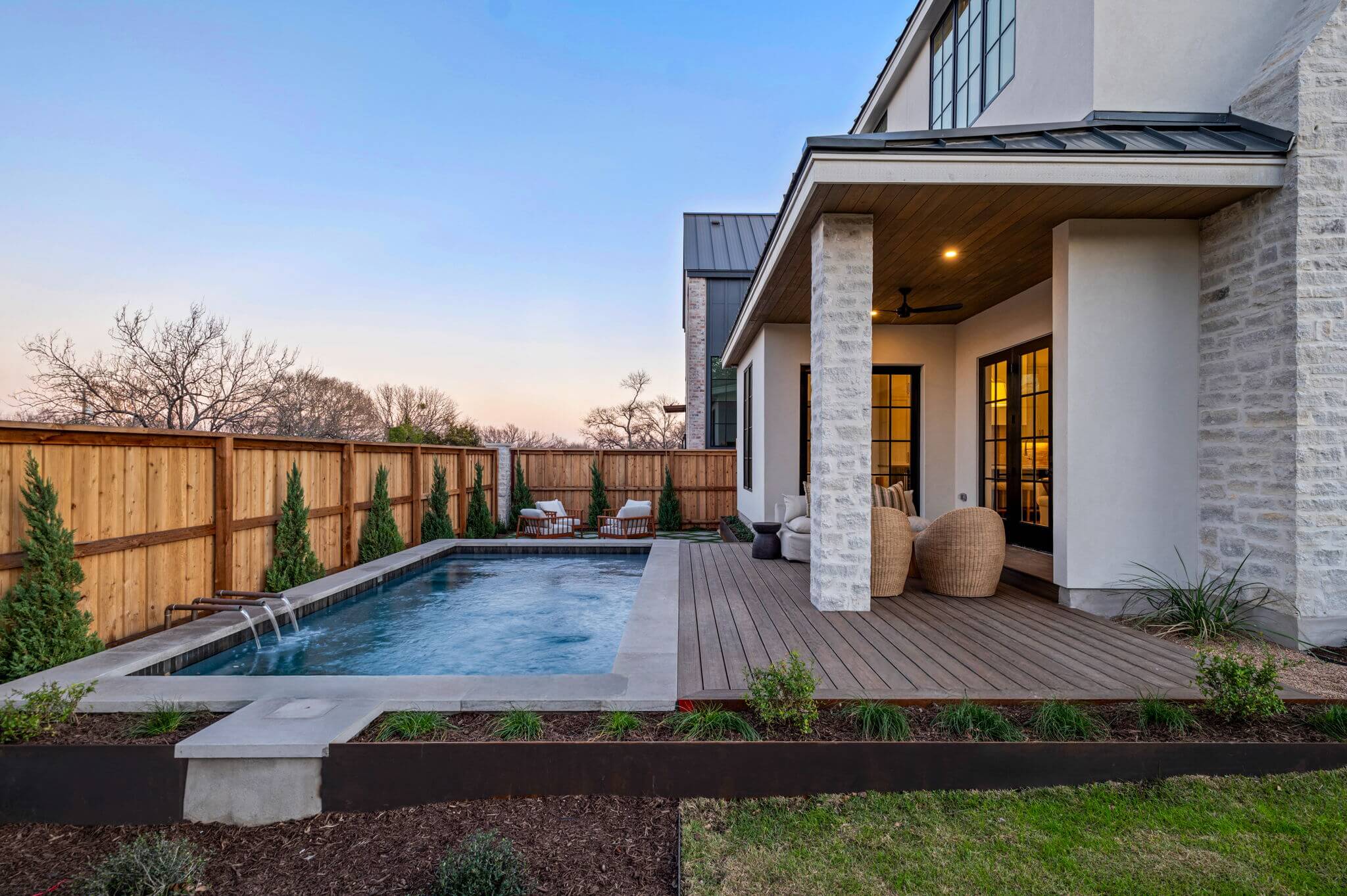 Golden Hour Pools Custom in Austin, featuring new construction with covered patio and gunite plaster finish