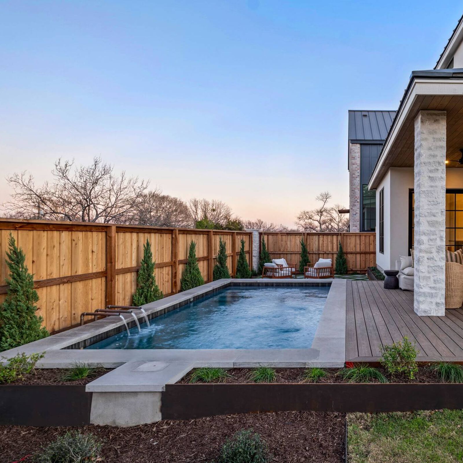 Golden Hour Pools Custom in Austin, featuring new construction with covered patio and gunite plaster finish