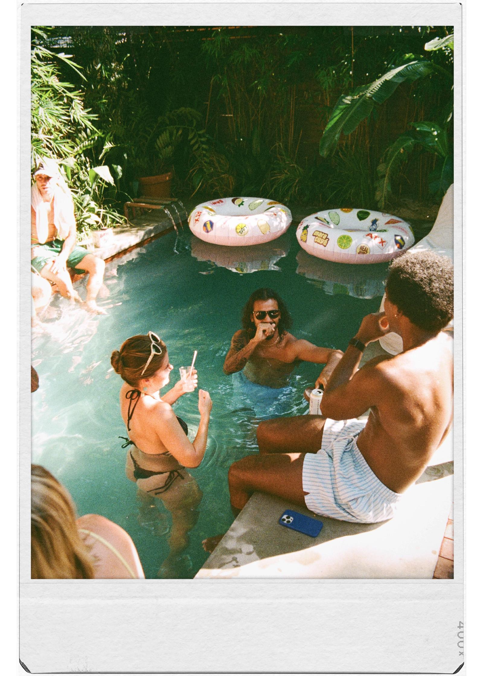 Friends enjoying a pool party in a Golden Hour Pools Classic pool in Austin, Texas