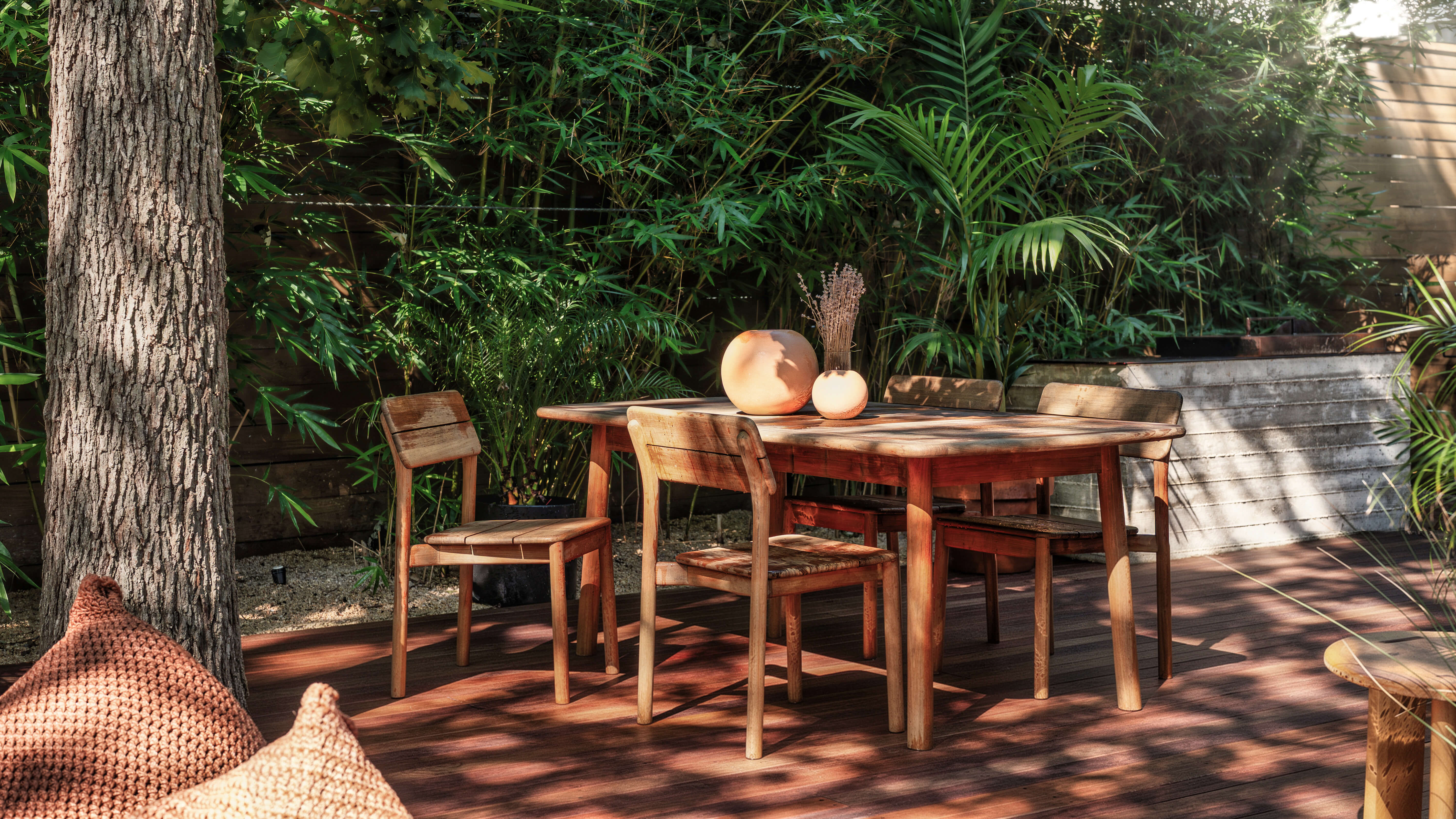 Golden Hour Pools Classic in Austin, featuring poolside teak deck with dining table and bamboo garden in Zilker