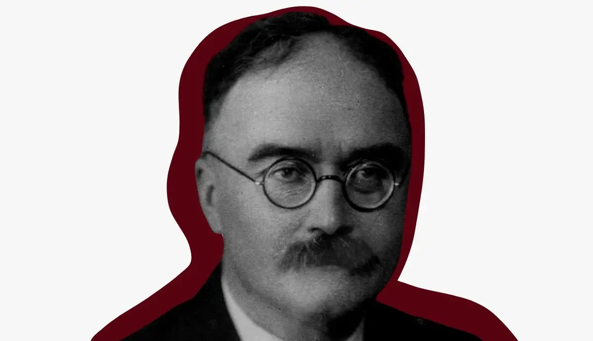 Historical black and white portrait of French sociologist Maurice Halbwachs wearing round spectacles and a mustache, set against a dark red outline.