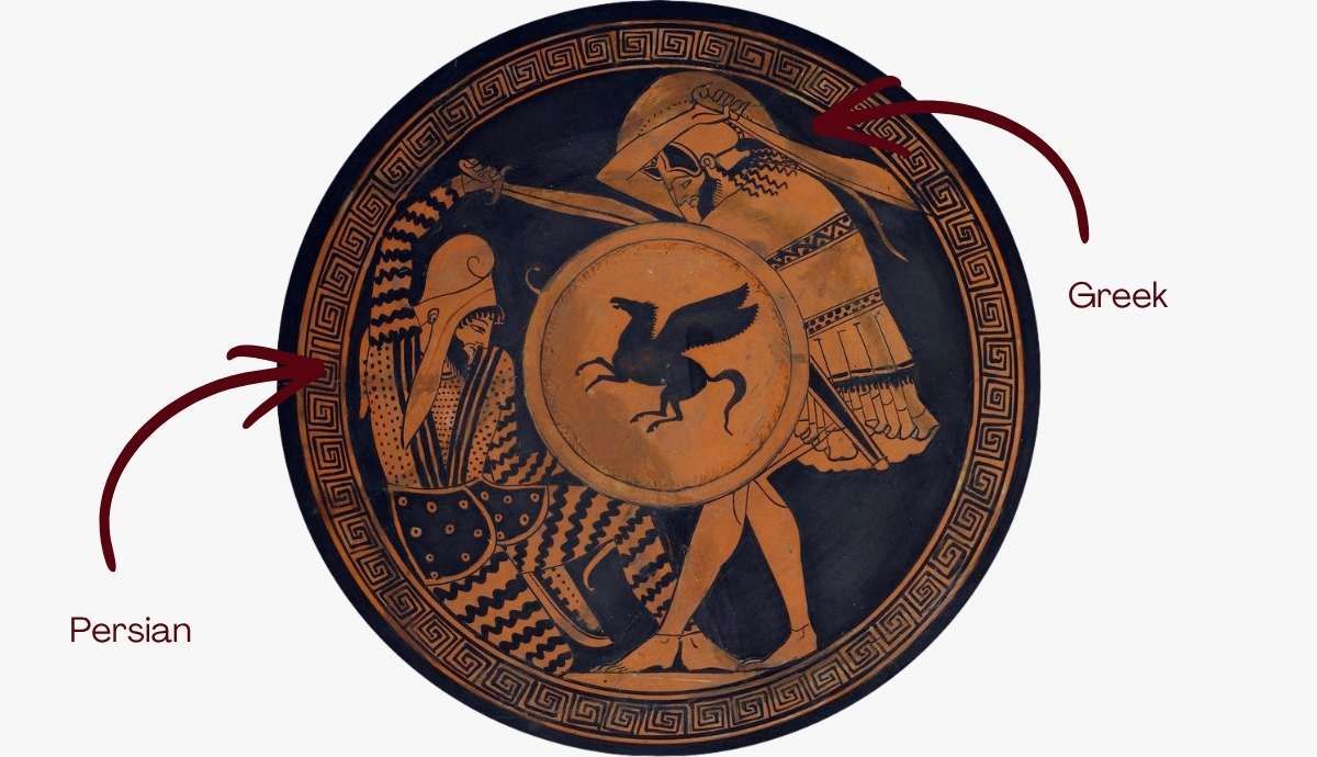 Ancient Greek red-figure pottery tondo showing a combat scene between a Greek hoplite in armor and a Persian soldier in patterned trousers and a Phrygian cap, illustrating the visual distinctions between the two cultures.