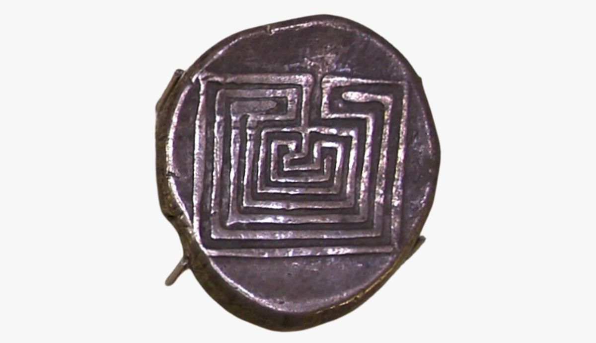 Ancient silver drachma coin from Knossos featuring a detailed geometric square maze representing the mythological Labyrinth of King Minos.
