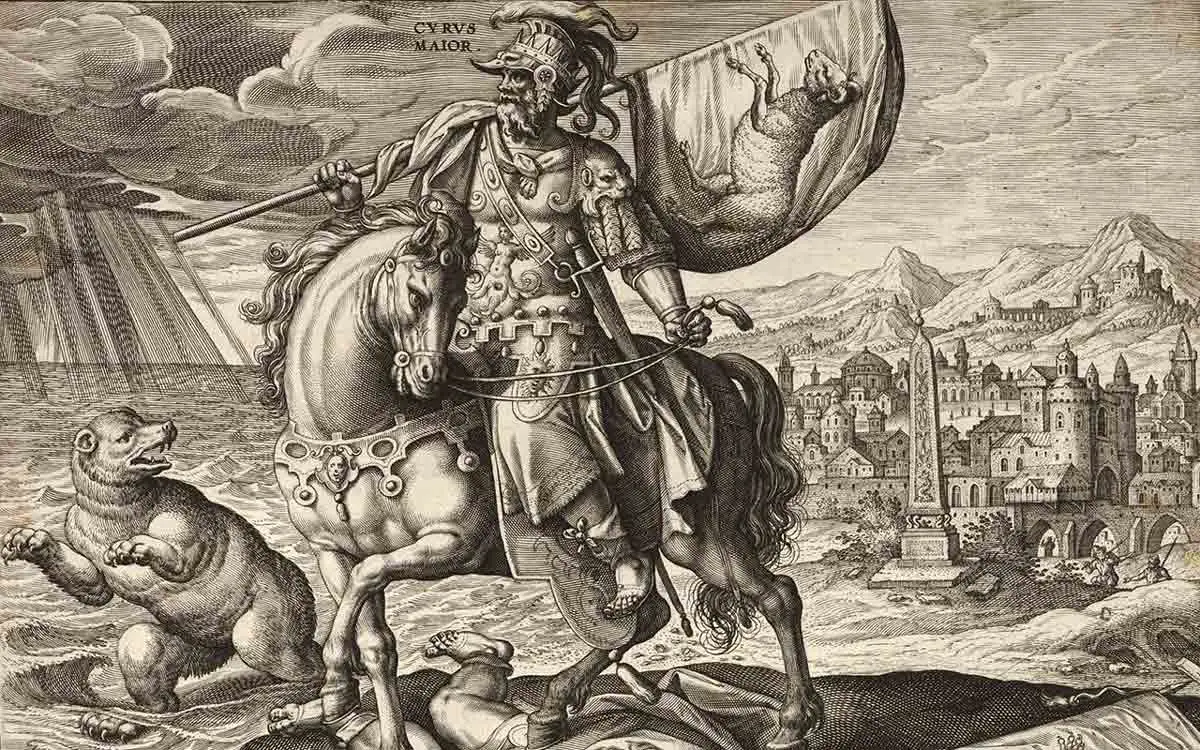 A detailed 16th-century style engraving titled "Cyrus Maior." It depicts Cyrus the Great in ornate armor on a horse, trampling a fallen enemy. A bear stands in the background to the left, and a sprawling ancient city with an obelisk is visible to the right.