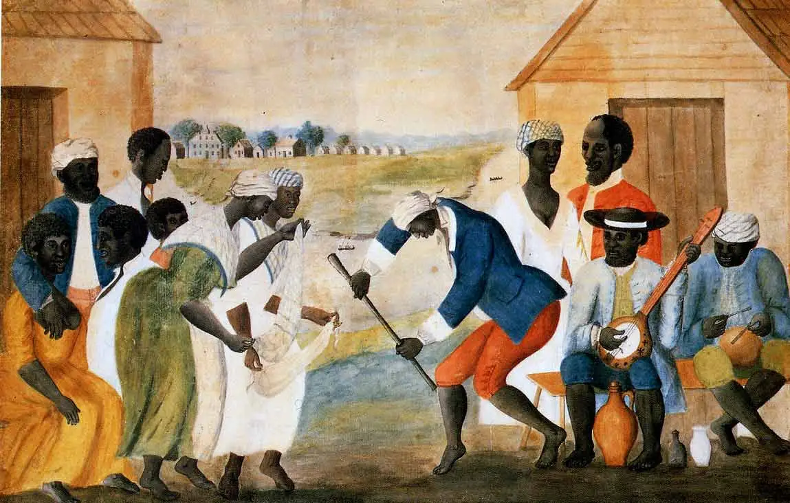 An 18th-century painting depicting a group of enslaved individuals dancing and playing drums and stringed instruments outside small wooden cabins. The scene captures a complex moment of community and 'shadow-life' set against the background of a rural plantation.