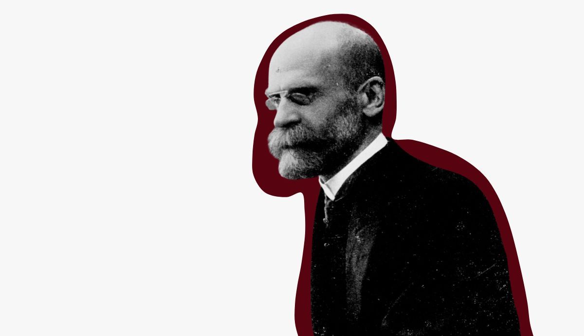 Historical black and white profile portrait of French sociologist Émile Durkheim, featuring a prominent beard and spectacles, with a dark red background outline.