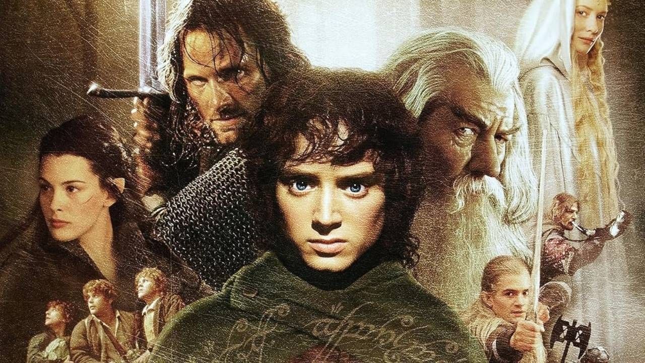 A cinematic montage of The Lord of the Rings characters, featuring Frodo Baggins in the center looking forward, surrounded by Aragorn wielding a sword, Gandalf the White, Galadriel, Arwen, Sam, Pippin, and Legolas.