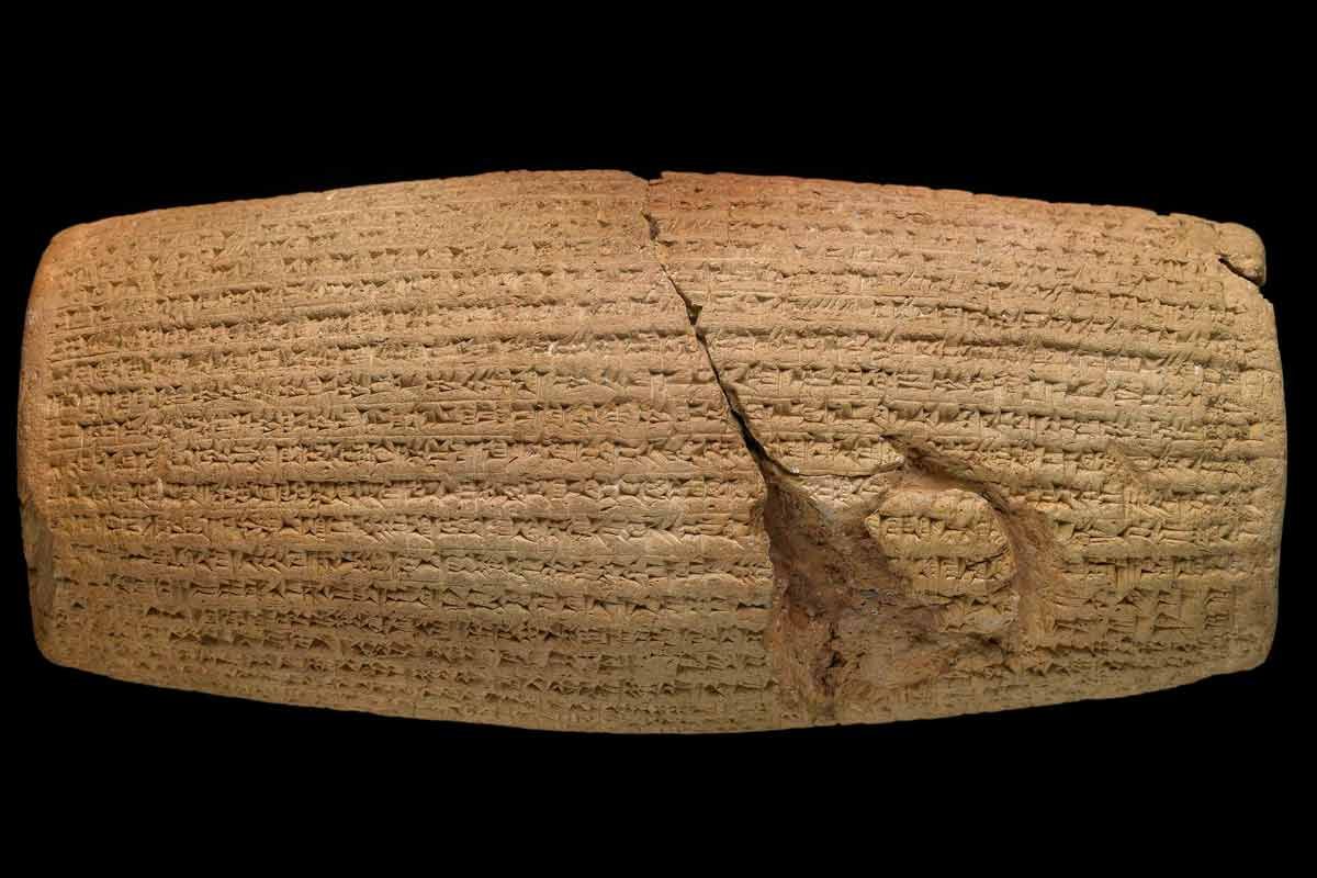 The Cyrus Cylinder, an ancient Babylonian clay artifact inscribed in Akkadian cuneiform script, detailing Cyrus the Great's conquest of Babylon and his policies of religious tolerance and repatriation.