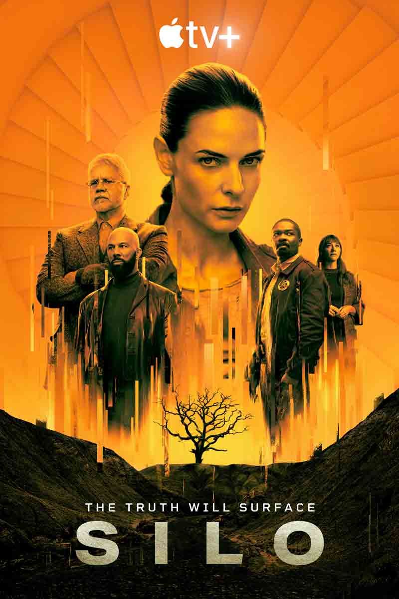The official orange-tinted Apple TV+ poster for the sci-fi series Silo, featuring the faces of four main characters looming over a fiery, subterranean crater that surrounds the dark silhouette of a dead tree.