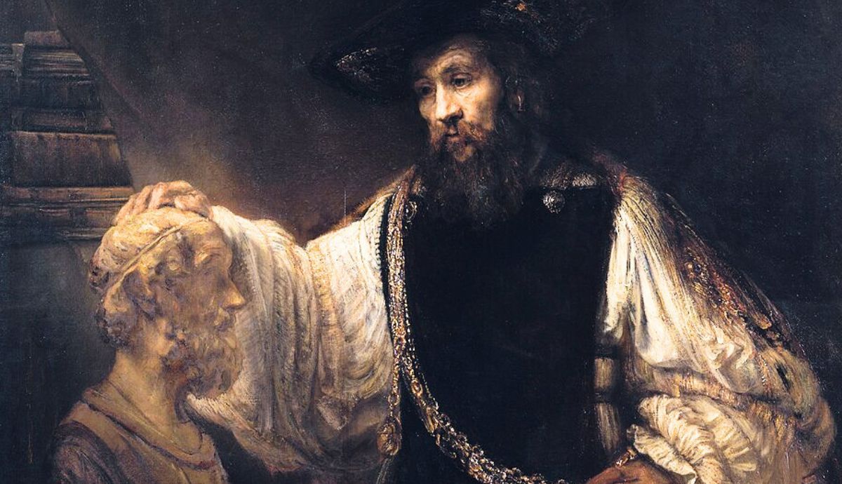 Classic Rembrandt oil painting depicting Aristotle in a wide-brimmed hat and elegant white sleeves placing his hand on a stone bust of Homer.
