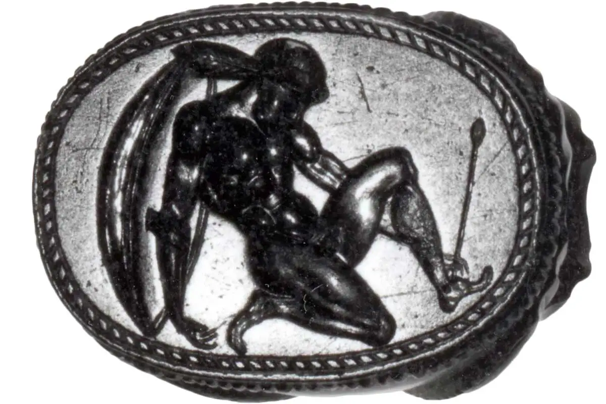 Engraved cornelian scarab depicting wounded Achilles. Etruscan. c. 400–350 BC.