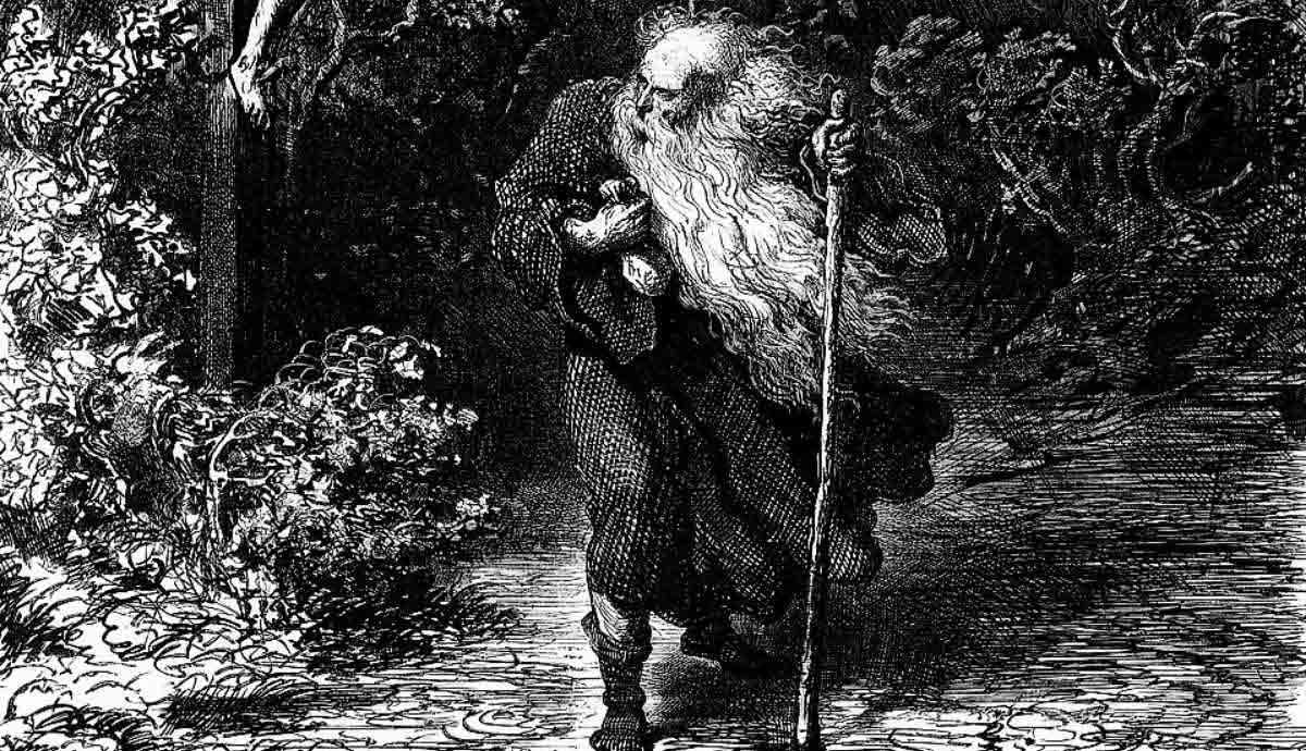 A detailed black-and-white engraving by Gustave Doré depicting Ahasuerus, the Wandering Jew, as an old man with a long, wild white beard and tattered robes, leaning on a walking staff as he trudges along a dark, densely wooded path.