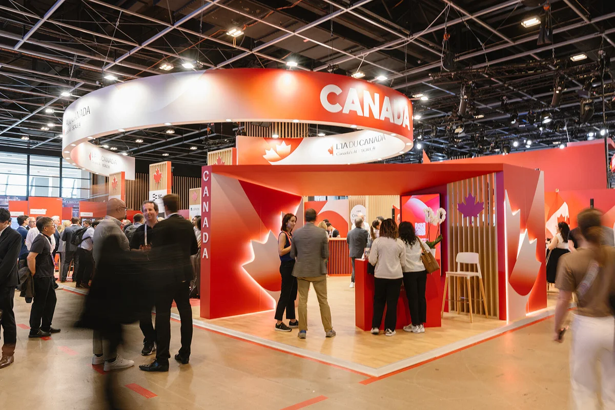 Canada Pavilion at VivaTech 2026, featuring red and white branding with maple leaf signage and visitors exploring the exhibition space.