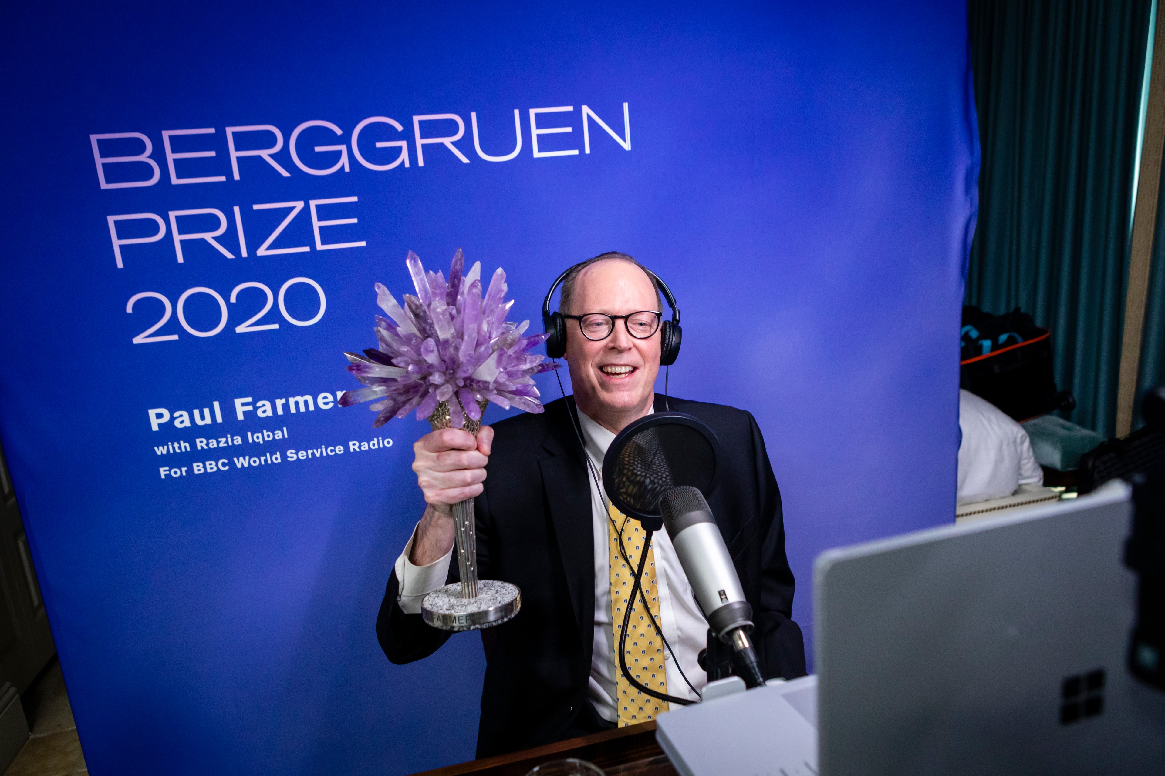 Dr. Paul Farmer holding the Berggruen Prize in 2020