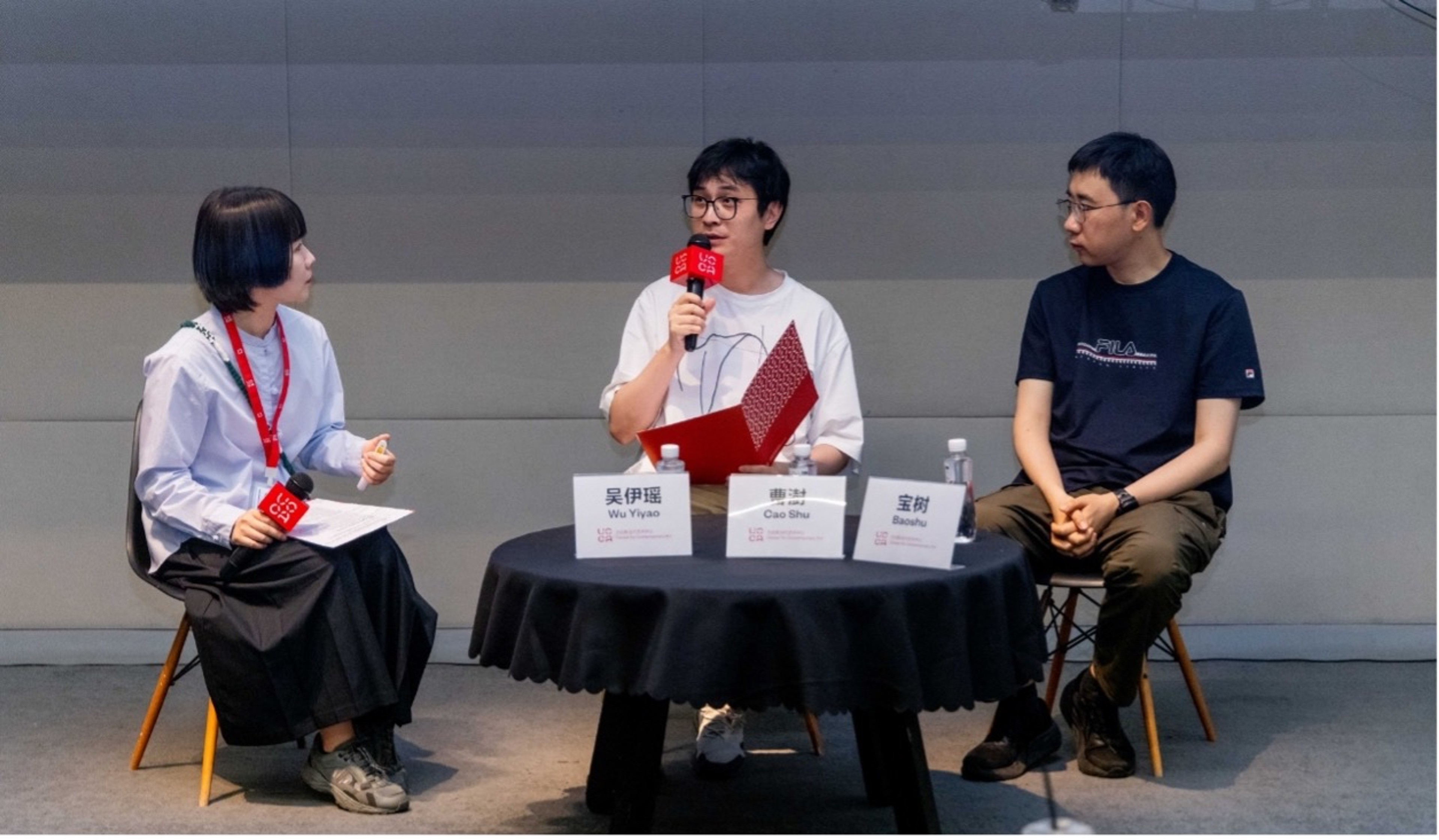 The speakers were Baoshu, a science fiction writer, and CAO Shu, a cross-media artist, with WU Yiyao, a UCCA Public Program curator, moderating the event.