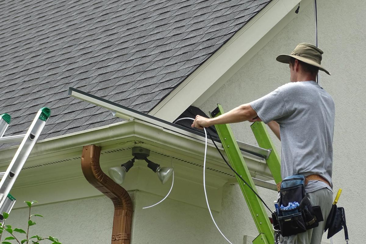 Charlotte Trimlight installer mounting channel to fascia