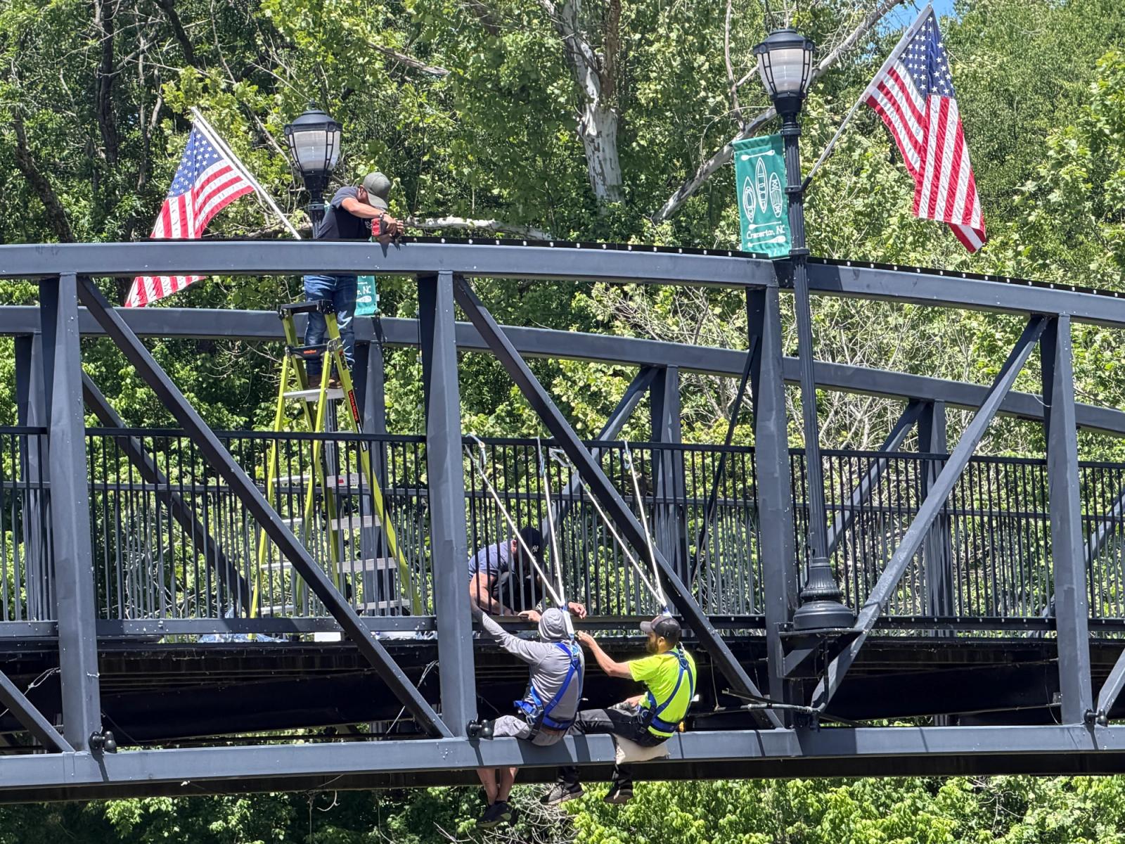 Crew working the arch span over the river in Cramerton, NC