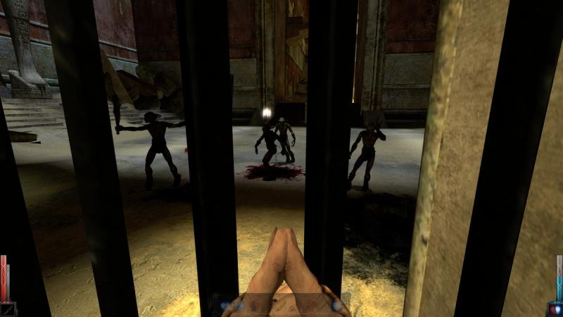 A first-person screenshot from the video game Dark Messiah of Might and Magic. The player's view is obstructed by vertical iron bars, looking out into a large stone hall where three goblin enemies stand near pools of blood. The game's user interface is visible at the bottom of the screen.