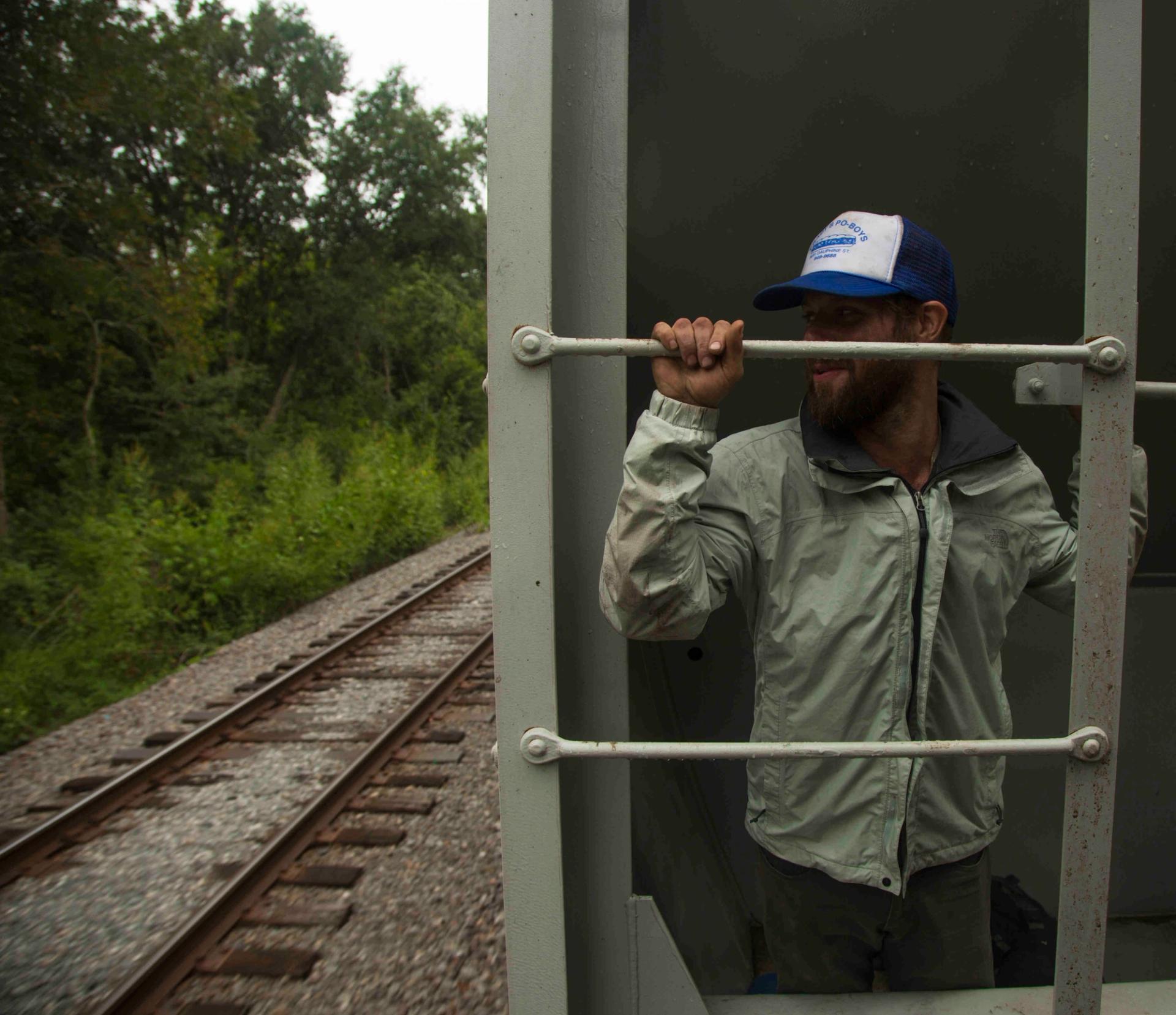 Photo of James Norman catching ride on a train