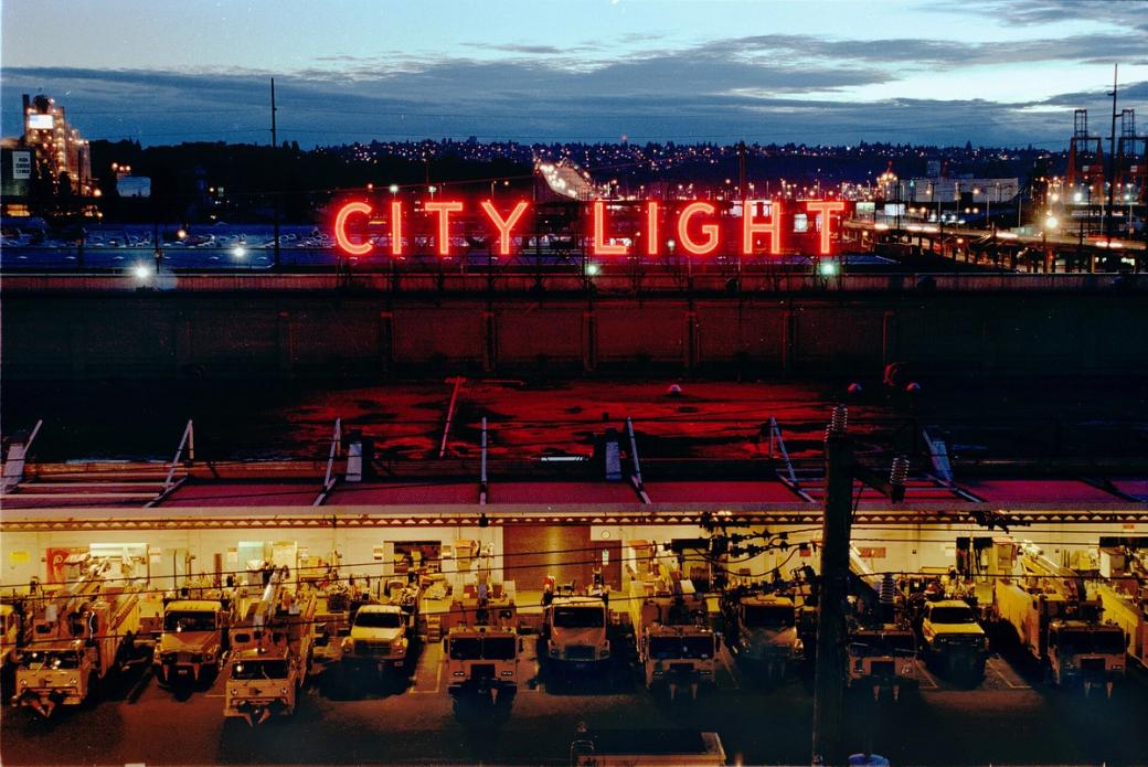 An image of the Seattle City Light south service center building illuminated at night