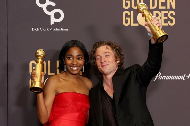Ayo Edebiri and Jeremy Allen White pose with their Golden Globes Sunday in Beverly Hills