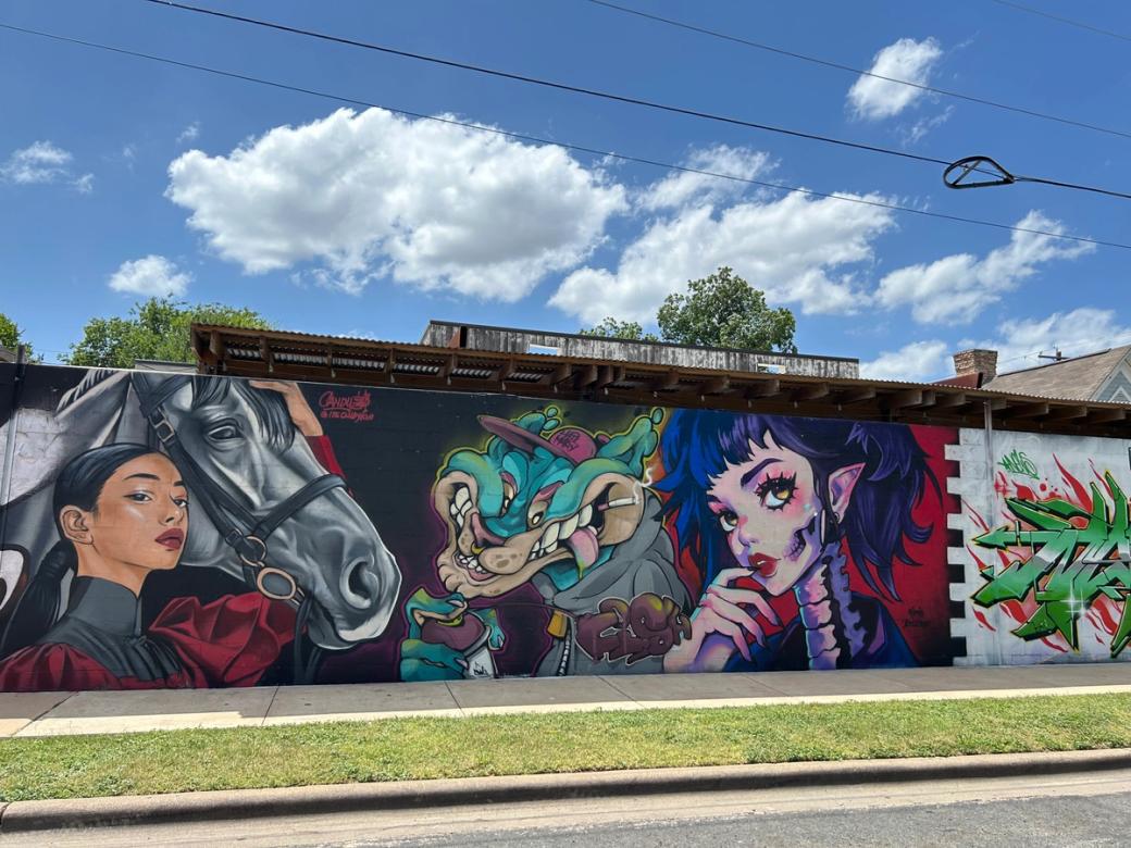 A wall with a colorful mural.