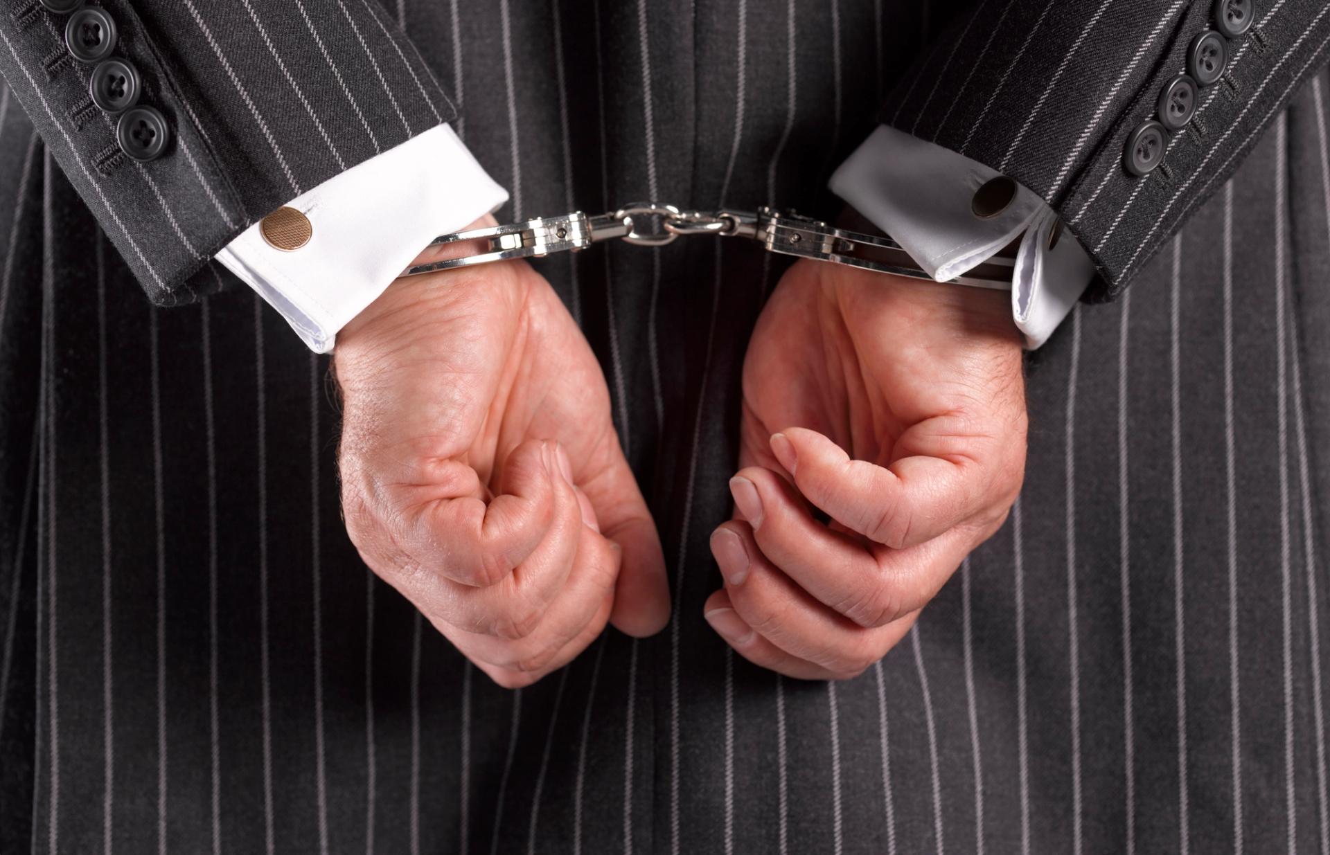 Photo of hands in handcuffs