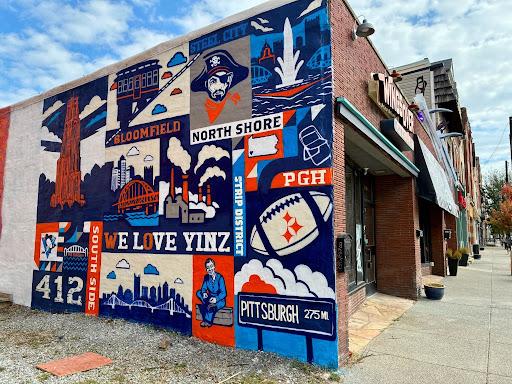 Mural with Pittsburgh elements, 412, pirate, north shore, bloomfield and "we love yinz"
