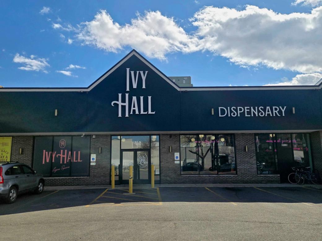 Exterior of commercial building on sunny day with signage that reads "Ivy Hall" and "Dispensary"
