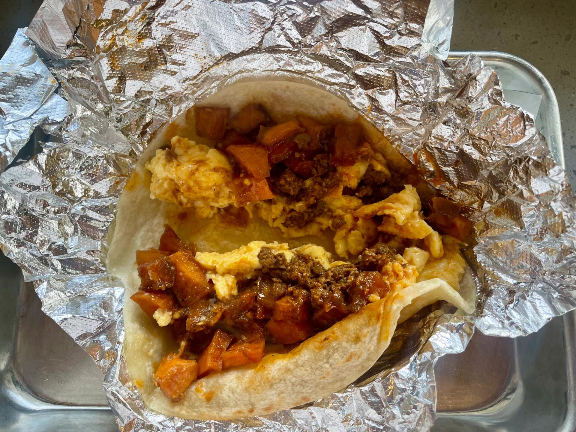 Chorizo, egg, sweet potato, and chili pequin on a flour tortilla from Ladybird Taco East. (Marie Cecile Anderson / City Cast Nashville)