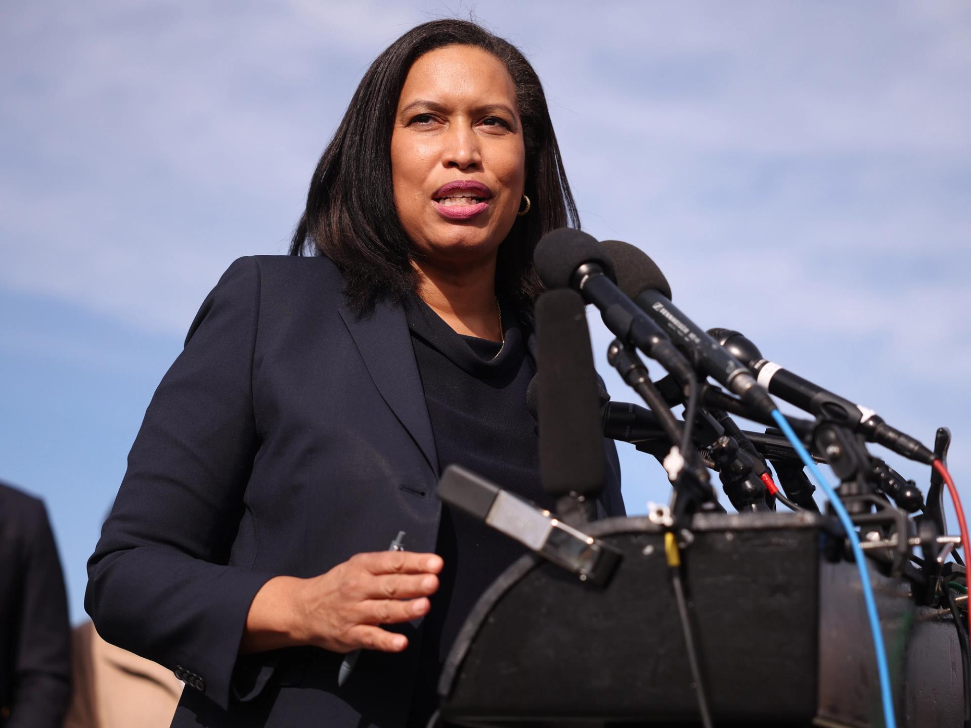D.C. Mayor Muriel Bowser speaking at a podium.