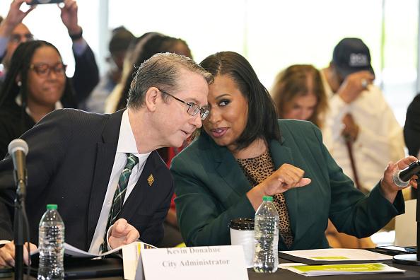 D.C. Mayor Muriel Bowser talking tea with City Administrator Kevin Donahue during the Fiscal Year 2026 Budget discussions at MLK Library. (Lenin Nolly for The Washington Post/Getty Images)