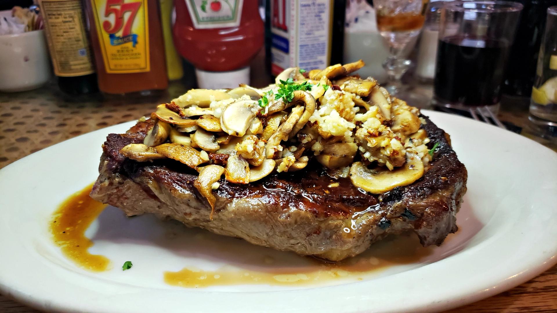 A steak topped with garlic at The Martin in Winnemucca, Nevada.