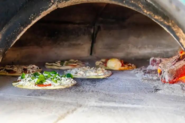 The inside of a pizza oven.