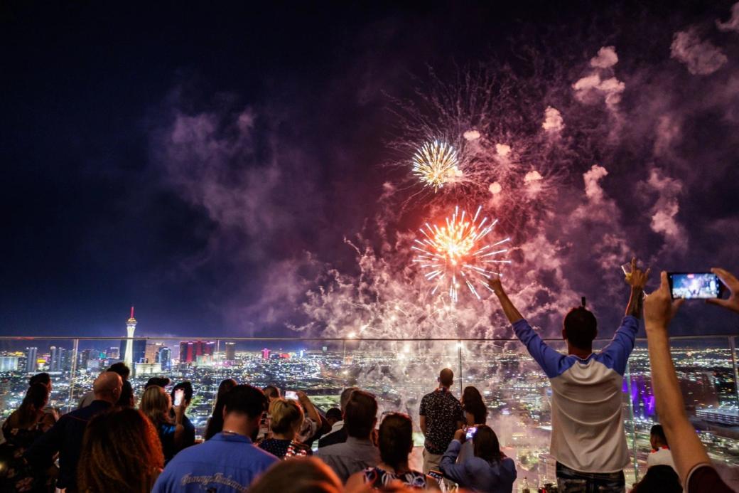 A crowd watches fireworks