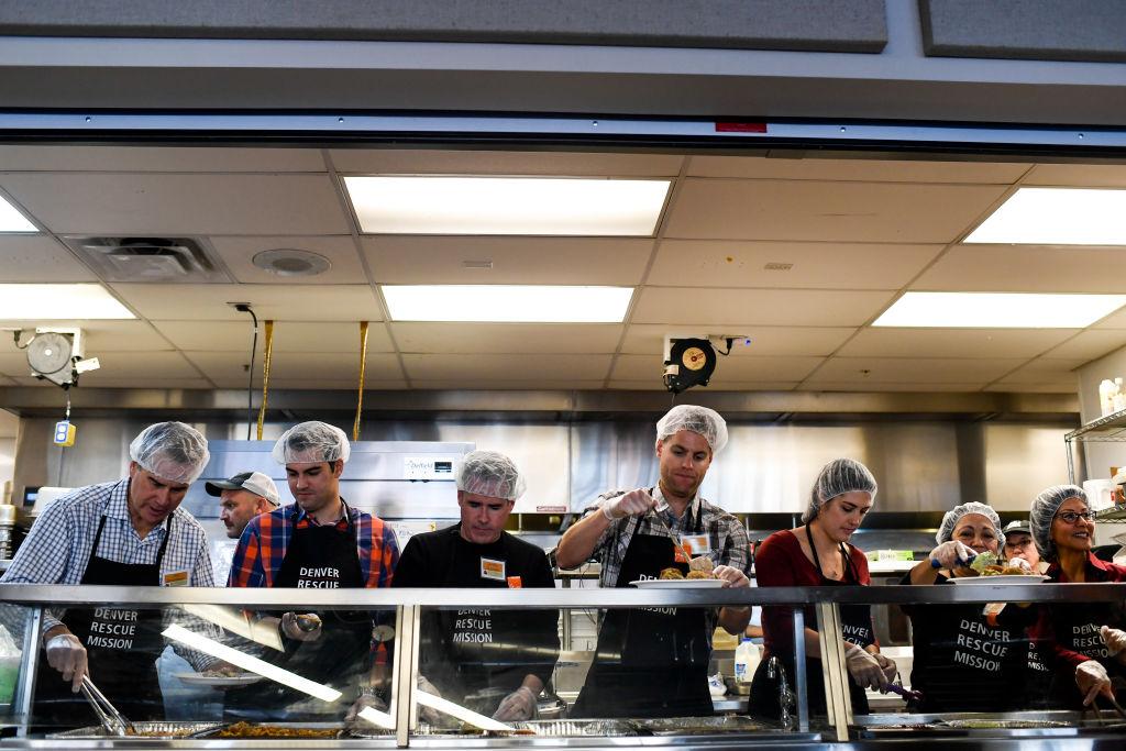 Volunteers plate meals at the Denver Rescue Mission.