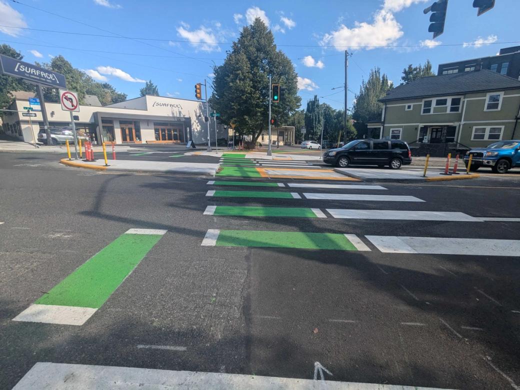 intersection with a bike crossing marked in green paint