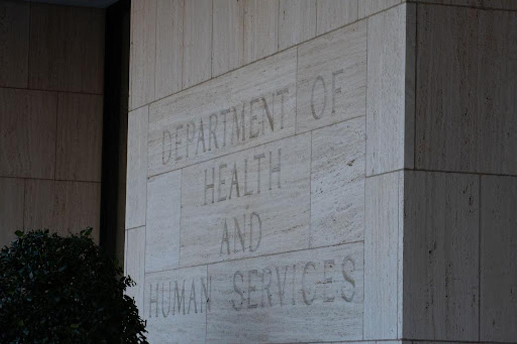 Department of Health and Human Services engraved on the stone facade of a government exterior. 