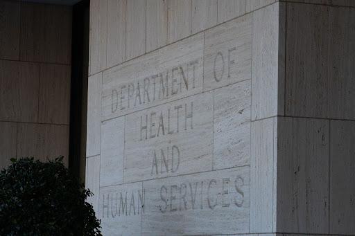 Department of Health and Human Services engraved on the stone facade of a government exterior.