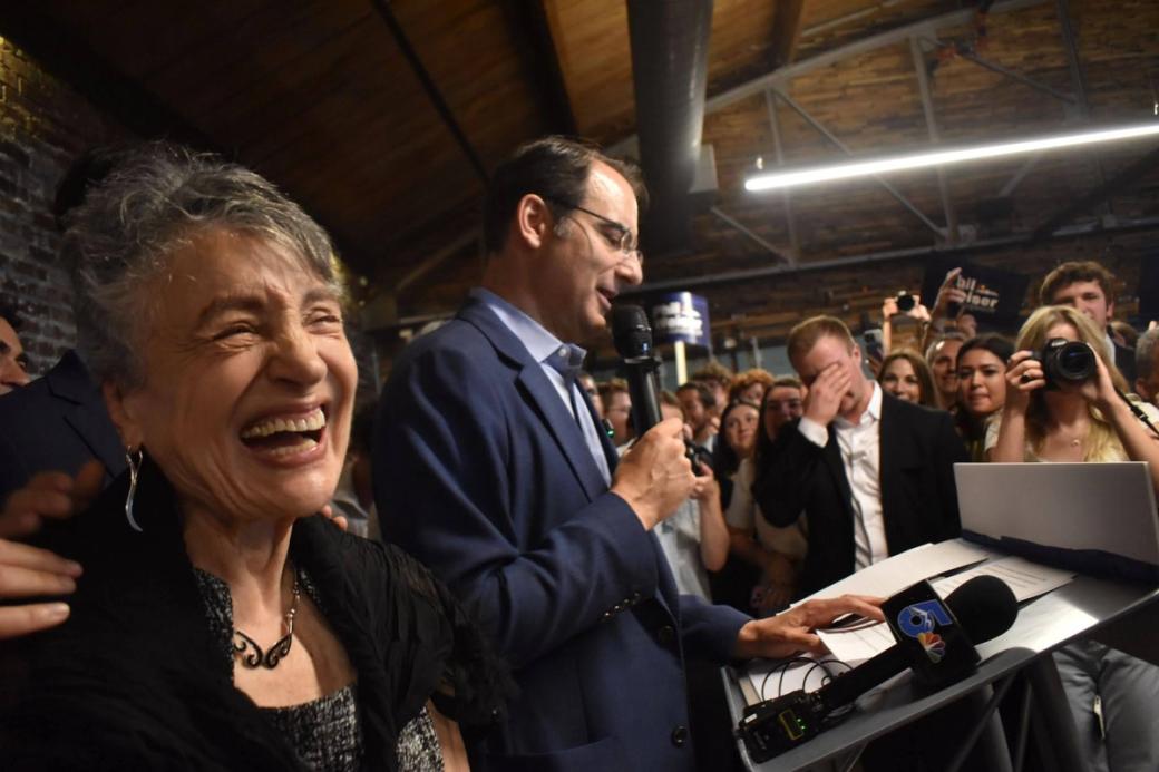 Phil Weiser’s mother Estare listens as her son celebrates victory in the Democratic gubernatorial primary.