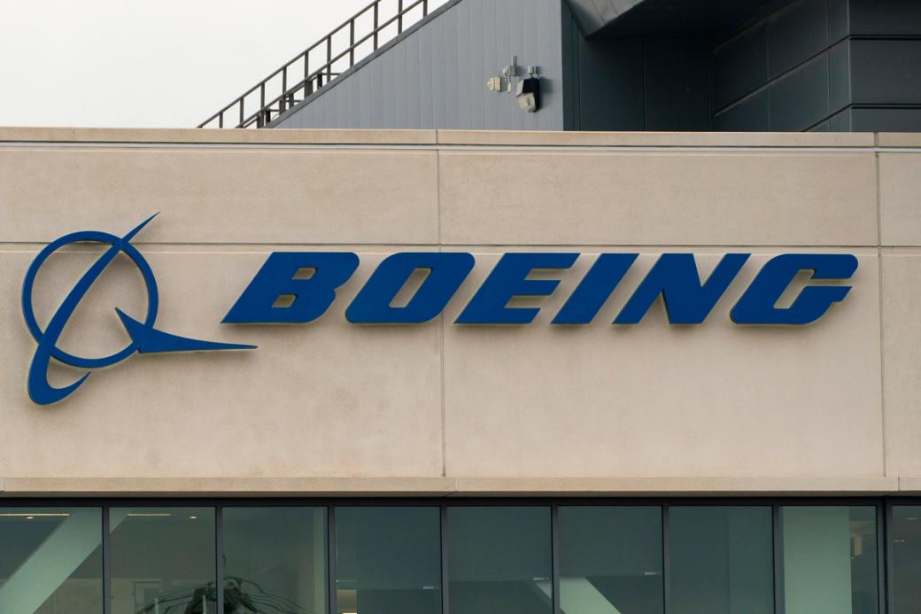 A blue Boeing sign on the exterior of a building