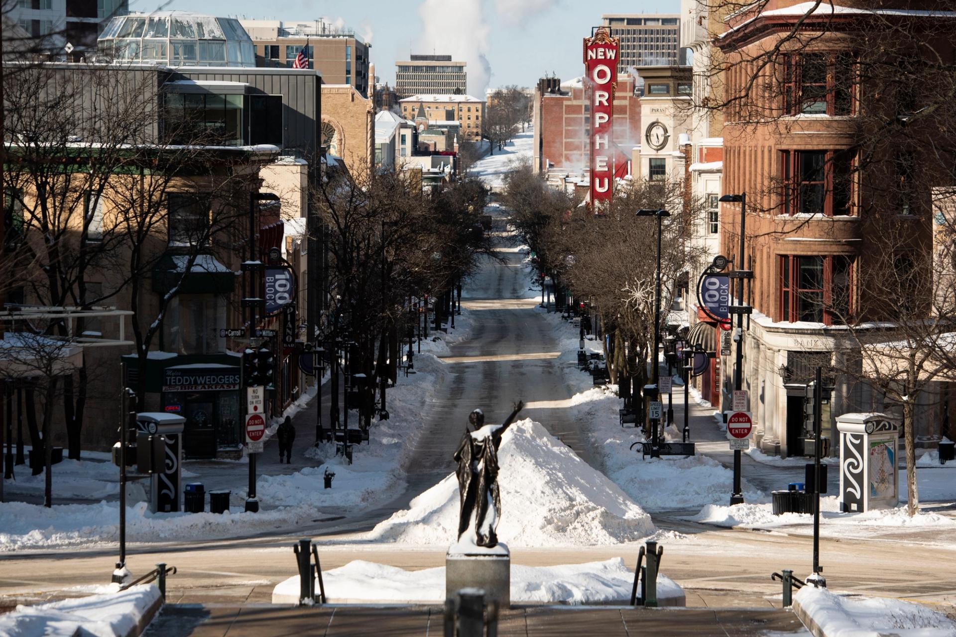 MADISON, WIS. JAN. 30, 2019: A sole individual walks down State Street in Madison, Wis. with extreme temperatures in Madison, Wis. Jan. 30, 2019.