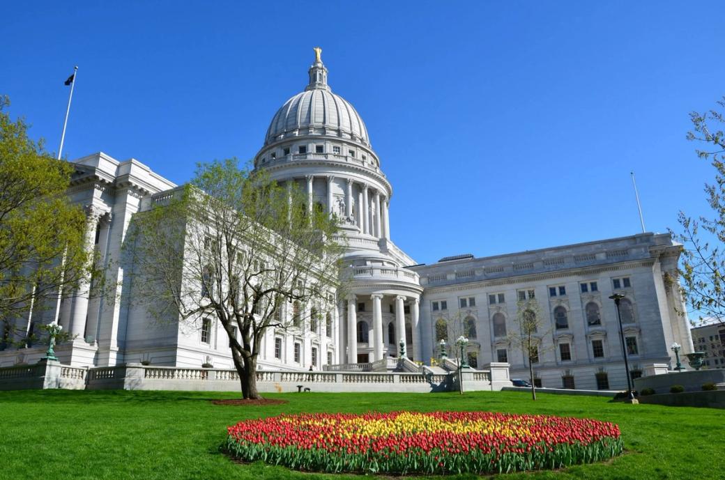 The State Capitol building and its green lawn.