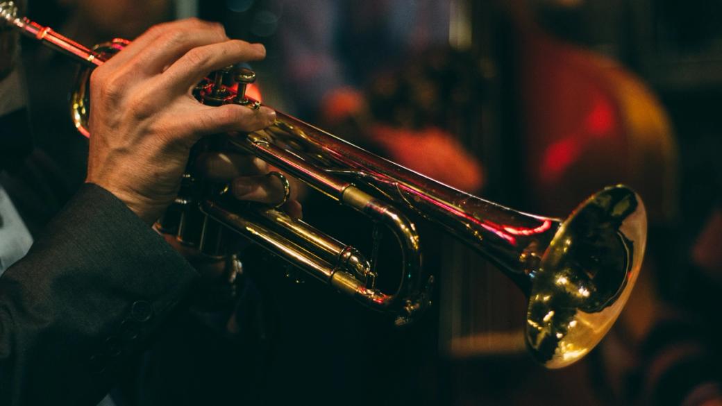 Faceless musician plays instrument