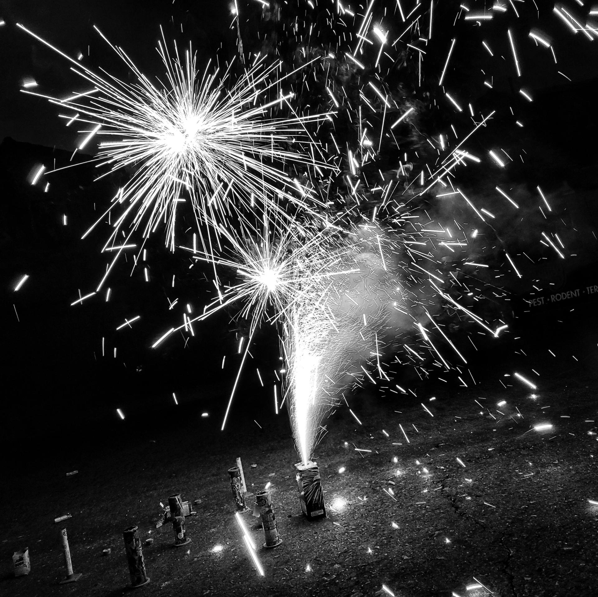 Photo of fireworks lighting in street