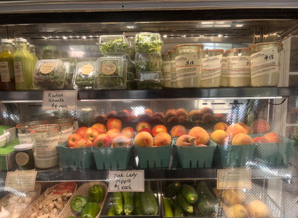 Produce and goods in a refrigerated section of the Ballerina Farm Store.