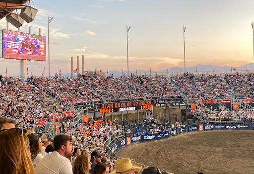 A packed crowd fills the stands at the Utah Days of ‘47 Rodeo in Salt Lake City at sunset.