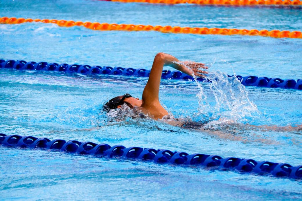 Swimmer does a lap in a pool